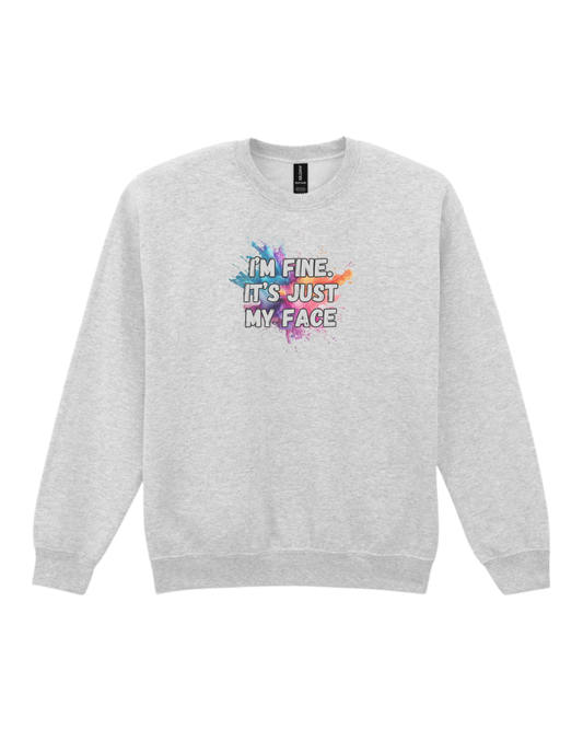 Ash unisex sweatshirt featuring the quote “I’m fine. It’s just my face.” in bold sublimated print